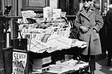 vintage photo of pulp magazine news stand in early 1900s