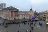 Line of people outside an old building