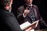 Actor Steven Elliot as Oscar Wilde points a finger at the prosecution barrister