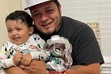 Image of Garcia holding one of his little ones