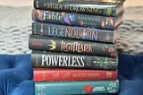 a stack of YA fantasy books