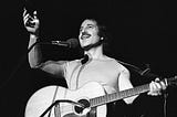 A black and white image of singer Paul Simon