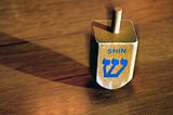 Dreidel: A Seemingly Foolish Game That Contains the Moral World in Miniature