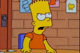 Bart Simpson stands from his desk in defiance.