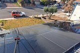 Solar panels are being cleaned. Two water-fed brushes are being used.