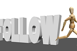 AQn Image of Follow text with a robot walking away from it.