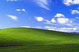 Windows XP “Bliss” wallpaper with green hill and blue sky