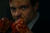 Jack Quaid as Nathan “Novocaine” Caine with bloody fists raised.