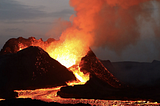 An exploding volcano in Iceland with hot lava pouring out