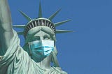 Statue of Liberty wearing a disposable mask.