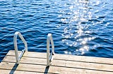 Ladder at the end of a pier on a lake