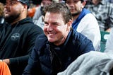 At the Dodgers-Giants game, Tom Cruise smashes a home run with the fans.