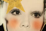 Cover art featuring a stylized photo of a woman with a Yellow star over her right eye (left side of the photo)