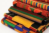 6 pieces of Kente cloths are stacked on each other. Credit to Ghanaweb.com