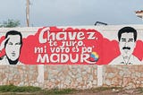 A mural featuring Hugo Chavez and Nicolas Maduro, two presidents of Venezuela.