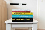 A set of productivity and time management techniques books sitting on a chair