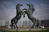 Photo Credit: @ EPA A statue of two stallions in front of the government Headquarters