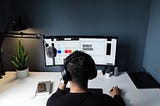 A designer on a computer representing the question: "Is Home Furnishings a Good Career Career Path?"