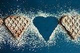 Heart shaped cookies garnished with sugar powder.