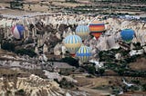 A Balloon’s Journey Soaring Over Cappadocia’s Timeless Landscape