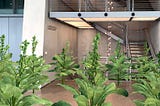 The lobby of the Whitney Museum with augmented reality tobacco plants growing from the floor