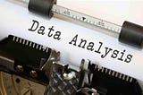 Picture of typewriter with the words Data Analysis typed onto a piece of paper