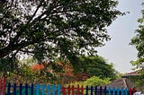 colourful fence with colourful trees