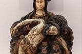 Title: Our Lady of Sorrows 

Object description: This polychrome wooden sculpture of the Pieta, is…