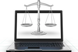 Laptop with justice scales on the screen