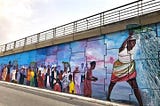 Murals unveil Accra’s brewing love saga between art, urban living & gentrification