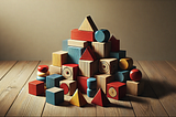 Small wooden blocks in different primary colors on top of a wooden floor.