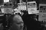 Man stands in front of Chicago Hotel Workers picket line