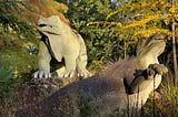 Statues of iguanadons in the Crystal Palace dinosaur park