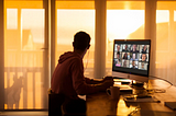 Man sat at his laptop doing online learning