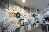 A view inside the Public Record Office of Northern Ireland showing floor to ceiling graphics covering a wall. Photograph taken by Natalie Adams.