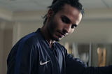 Mehdi Dehbi as Al-Masih sporting a Nike jacket. Top shot. He’s on a treadmill which is not seen in the picture.