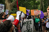 Students held a rally outside of City Hall calling for more investments in mental healthcare and restorative justice in schools.