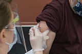 A man receives a covid vaccination injection in Anchorage, Alaska