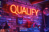 Neon lamp with the word ‘QUALIFY’ glowing on a wall, created using Midjourney.