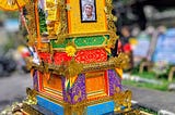 Brightly covered cremation tower in which decedent was transported to cremation ceremony.