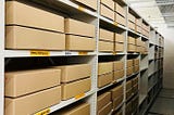 Rows of brown archive boxes that represent completed clinical study archive cataloguing.