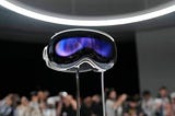 The Apple Vision Pro headset is displayed in a showroom on the Apple campus Monday, June 5, 2023, in Cupertino, Calif. The tech giant’s virtual reality equipment will allow users to overlay an augmented experience over the real world. (Jeff Chiu/The Associated Press). Source
