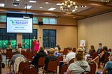 MI Treasury Outreach Manager Sarah Rusnell speaks to a room of workshop attendees