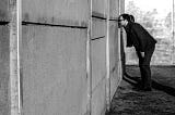 Berlin war memorial monochrome photo with man looking at wall