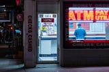 Photo by Alexandros Chatzidimos: https://www.pexels.com/photo/atm-booth-with-neon-signage-3652781/