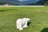 A small plastic polar bear acts as a tee box marker on a golf course in Whistler, Canada.