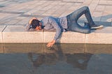 man gazes in pool