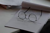 Spectacles on paper