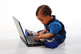 A baby on a computer