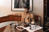 The writer, Talun Zeitoun, at a New York City restaurant by himself.